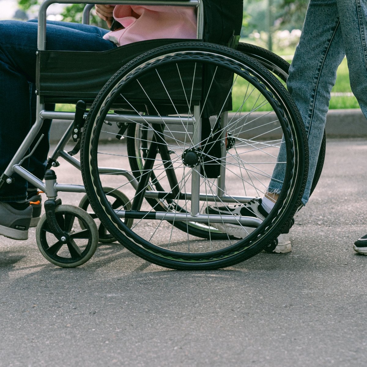 A person using a wheelchair outdoors