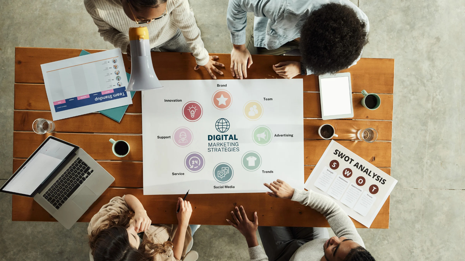 A team gathered around a table planning digital marketing strategies